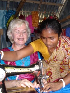 Photo 3- A Bangladesh Woman Entrepreneur sharing her skills with a Canadian Volunteer